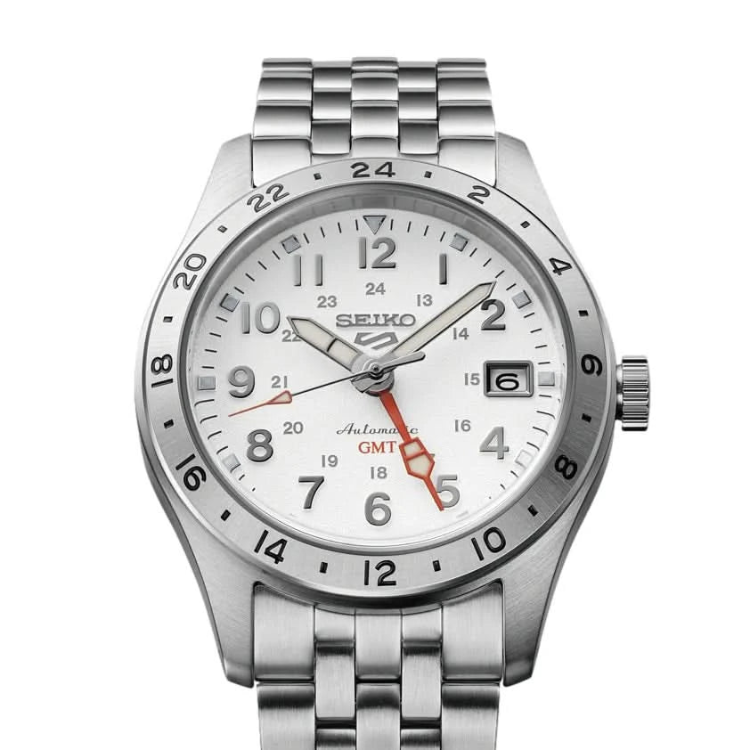 Silver Seiko watch with white face on a white background