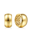 A pair of polished gold hoop earrings shown on a clean white background, with one earring facing forward to show its smooth rounded surface and the other angled to reveal an intricate openwork lattice pattern inside.