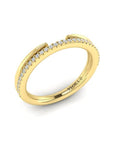 Gold ring with diamonds on a white background