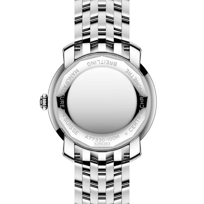 Close-up rear view of a silver stainless steel watch with a metal link bracelet, showing engraved details and branding on the case back against a white background.