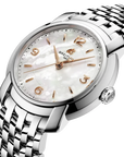 A close-up studio shot of a Breitling wristwatch with a silver stainless steel link bracelet, a white mother-of-pearl dial, and rose gold-tone hands and numeral markers.