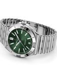 Silver watch with a green face on a white background LAYING