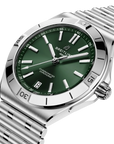 Breitling watch with green dial and silver metal bracelet on a white background
