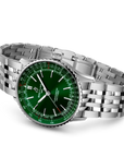 Silver watch with a green face on a white background angled view