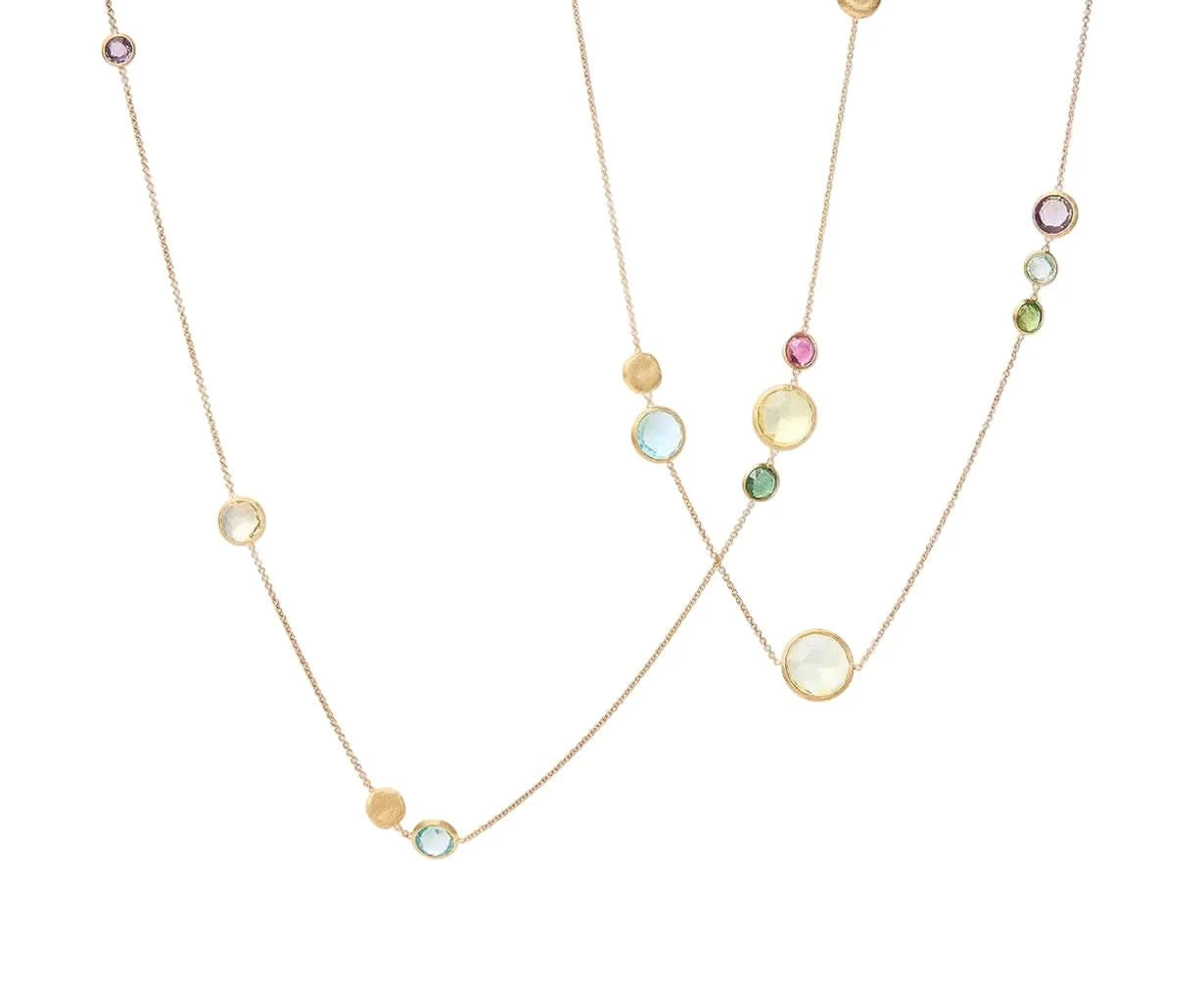 A delicate gold necklace featuring multiple small, round, colorful gemstone beads in pink, green, blue, and yellow, displayed against a solid off-white background.