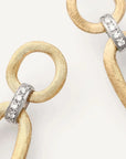 Goldstatement earrings with textured oval links and silver-toned diamond accents, shown on a clean white background.