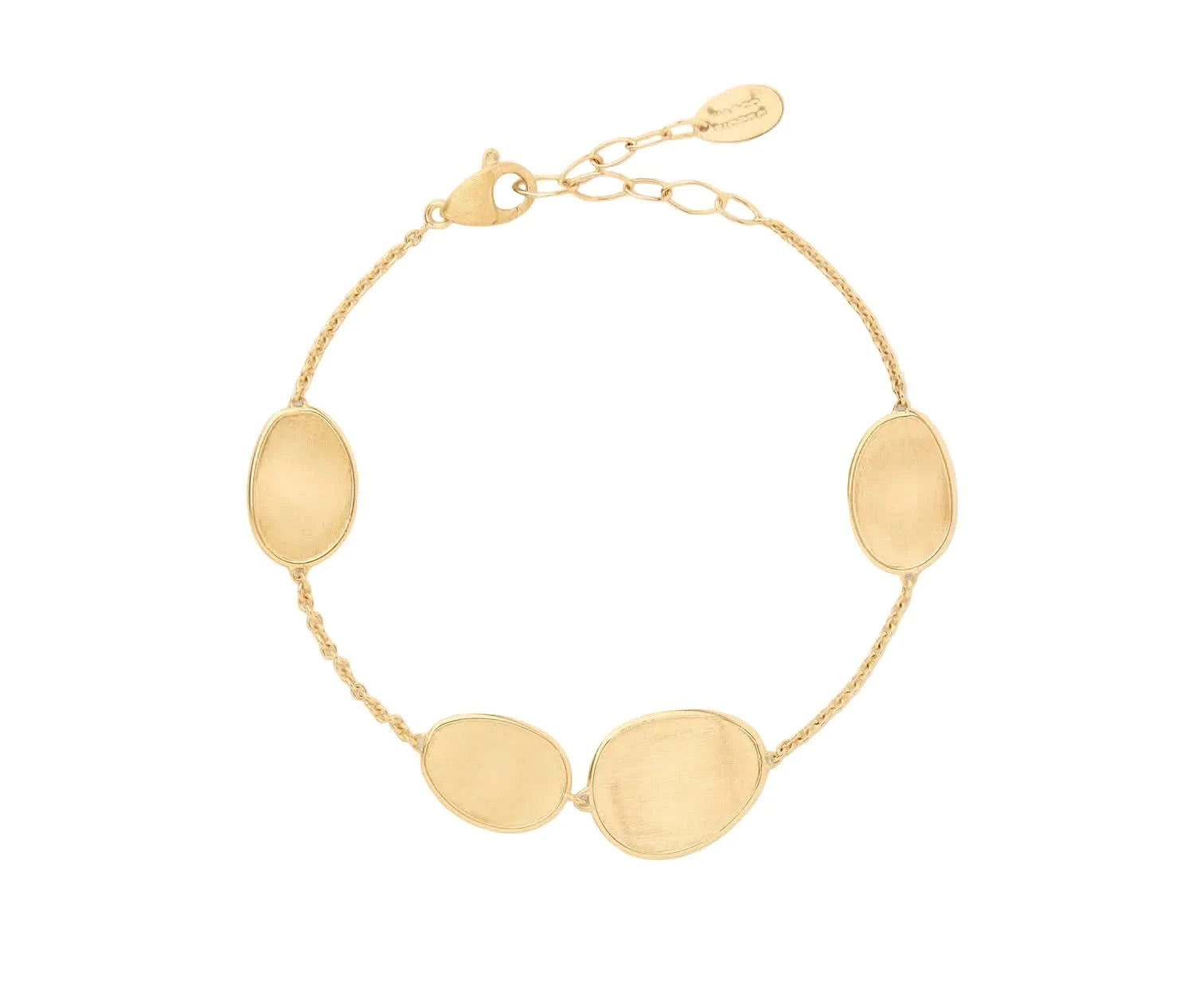 Gold bracelet with oval textured stations on a light white background