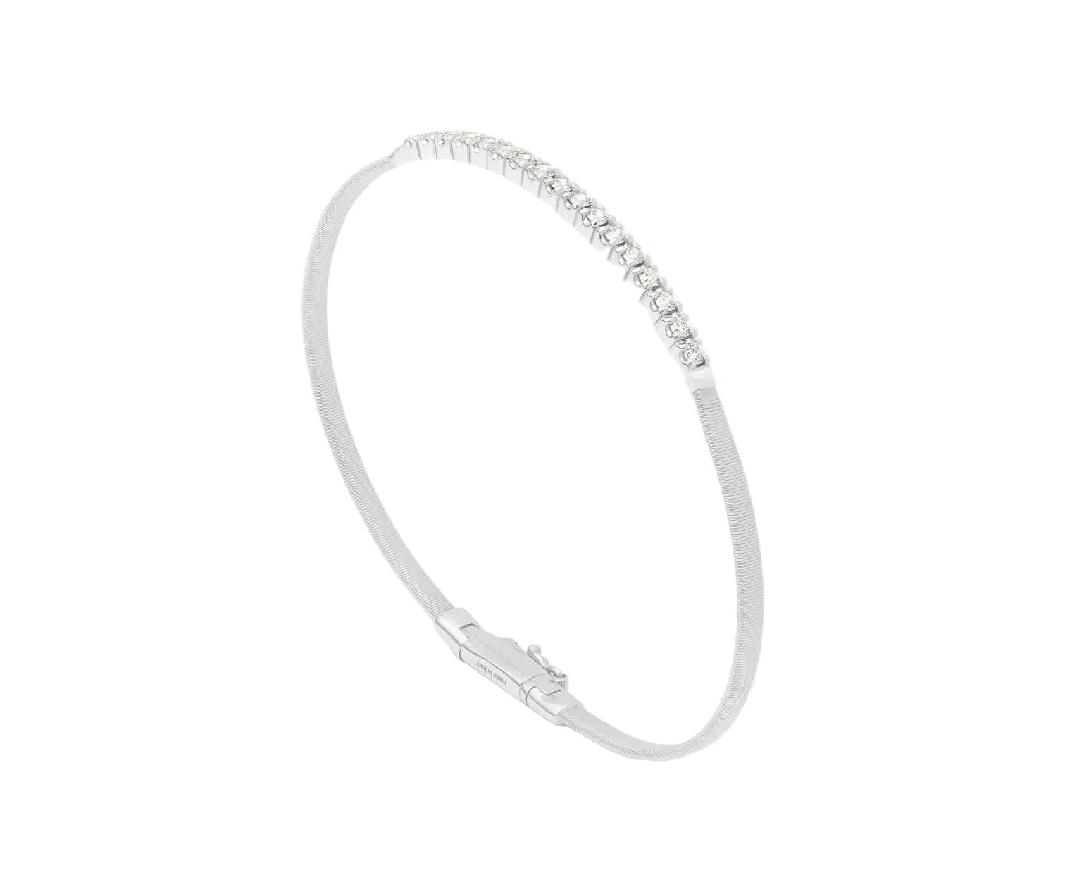 A slim silver bangle bracelet with a row of small clear stones along the top curve, shown on a plain light background.