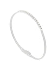A slim silver bangle bracelet with a row of small clear stones along the top curve, shown on a plain light background.