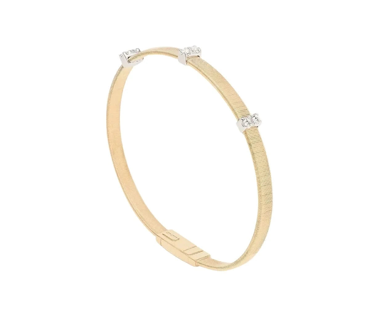 A slim yellow gold bangle bracelet with a textured band and three small diamond-set accents, shown on a light white background.
