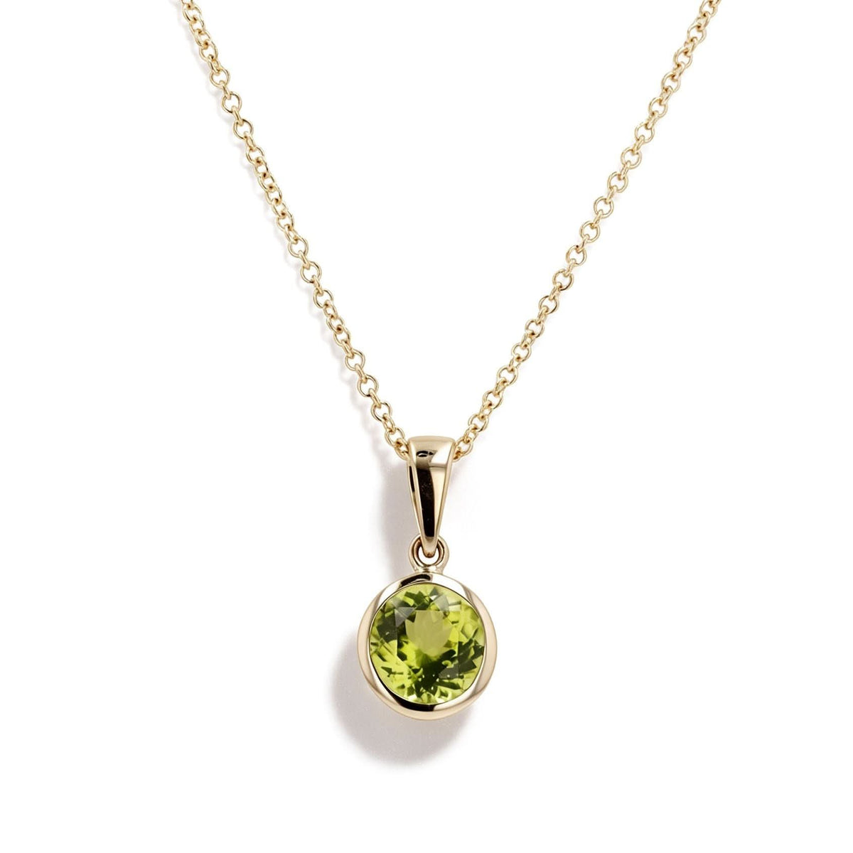 14K yellow gold round 7mm peridot bezel pendant, 1.46 carats, front view; chain shown for styling only