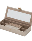 Beige jewelry box with compartments on a white background