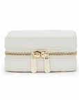 White jewelry box with gold zipper on a white background
