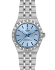 Silver watch with blue dial open bracelet on a white background
