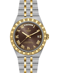 Tudor watch with silver and gold open bracelet on a white background