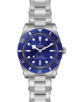 Silver watch with a blue dial on a white background open bracelet