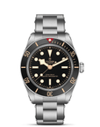 Tudor watch with black dial and silver metal strap on a white background