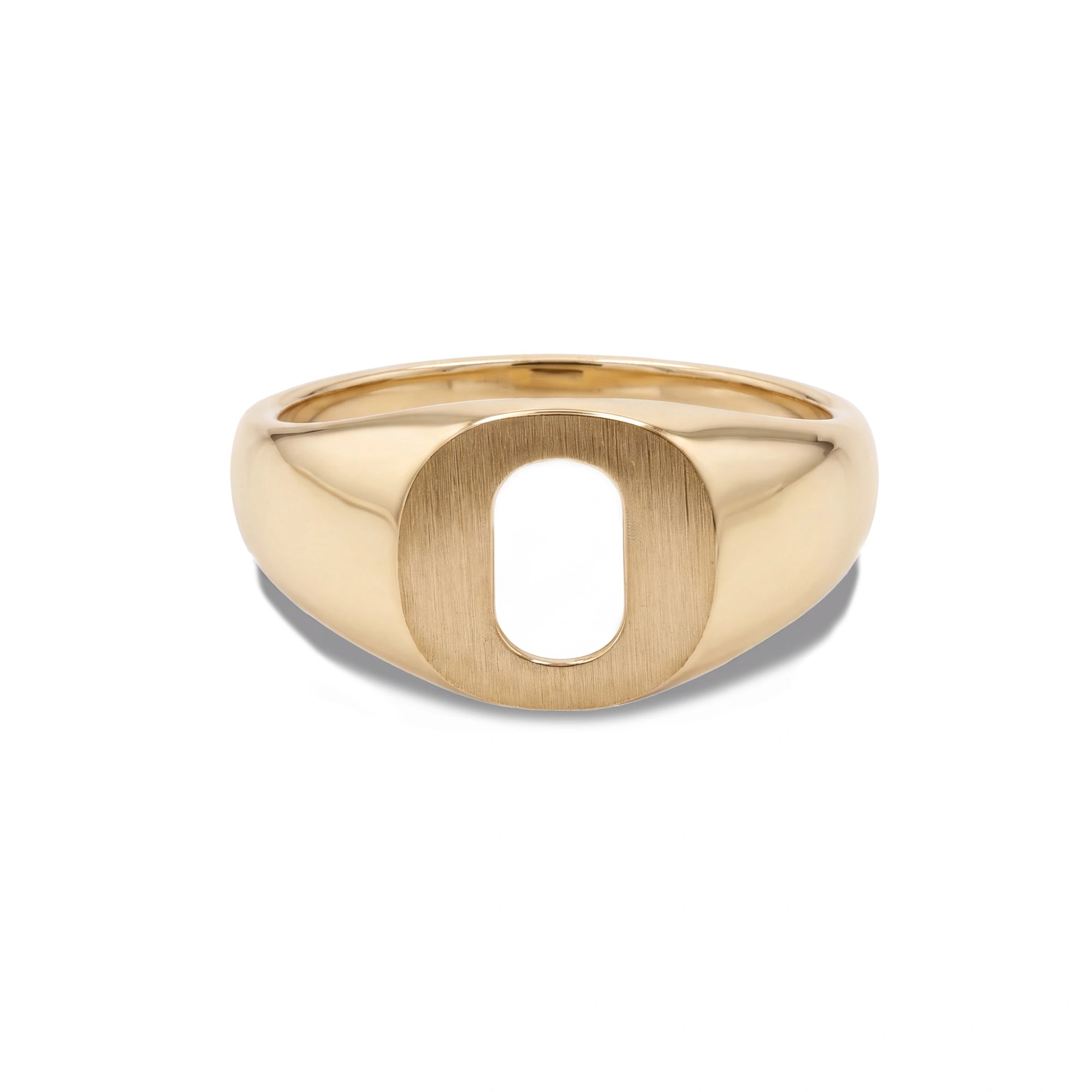 A polished yellow gold signet ring featuring a large, open oval letter 'O' face, set against a clean white background.