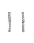 Pair of diamond hoop earrings on a white background