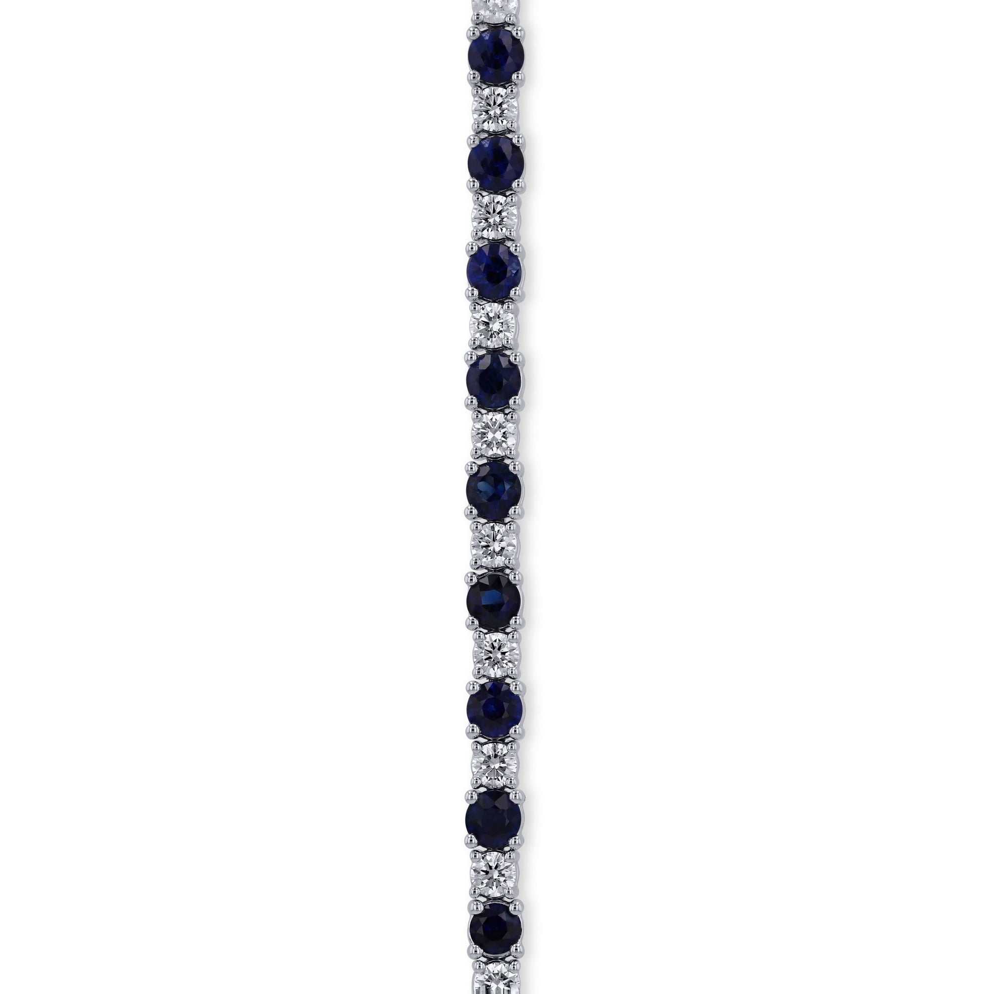 close-up of round sapphires and diamonds prong set bracelet on a white background