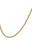 Gold necklace with embedded diamonds on a white background