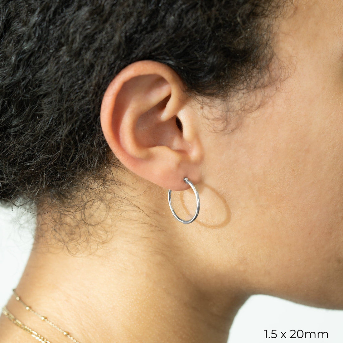 White Gold Tube Hoop Earrings by Carla | Nancy B.