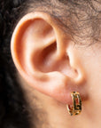 Close up of ear wearing Roberto Coin Huggies Navarra 18k Yellow Gold Earrings 