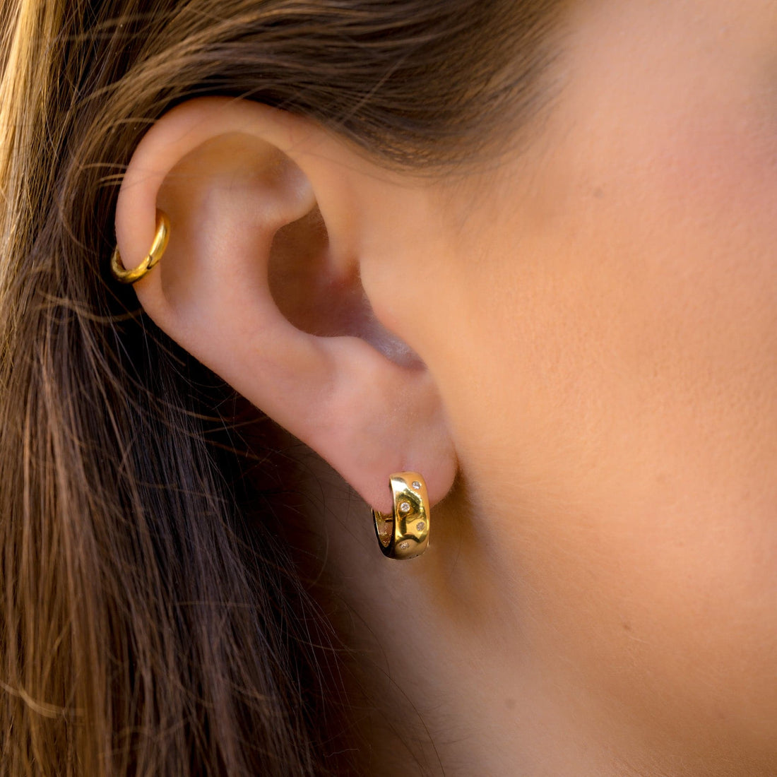 Roberto Coin Gold Huggie Hoops Diamond Earrings modeled