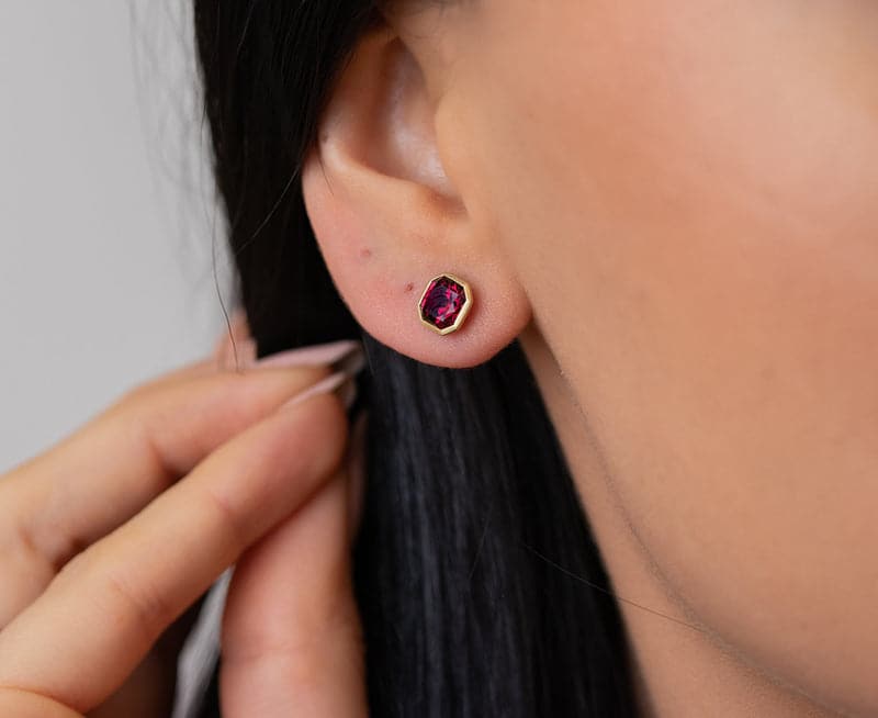 Kimberly Collins Square Faceted Rhodalite Garnet Studs on ears