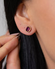 Kimberly Collins Square Faceted Rhodalite Garnet Studs on ears
